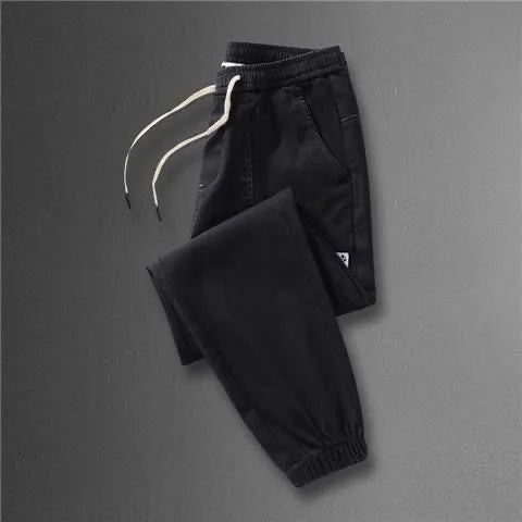 2023 Spring and Autumn New Classic Fashion Solid Color Haren Pants Men's Casual Slim Comfortable Elastic High Quality Jeans 5XL