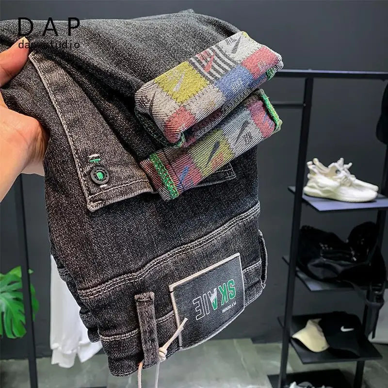 New High Quality Korean Luxury Slim Fit Denim Jeans with Letter Printed Design for Men Washed Streetwear Casual Cotton Trousers