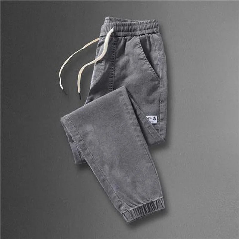 2023 Spring and Autumn New Classic Fashion Solid Color Haren Pants Men's Casual Slim Comfortable Elastic High Quality Jeans 5XL