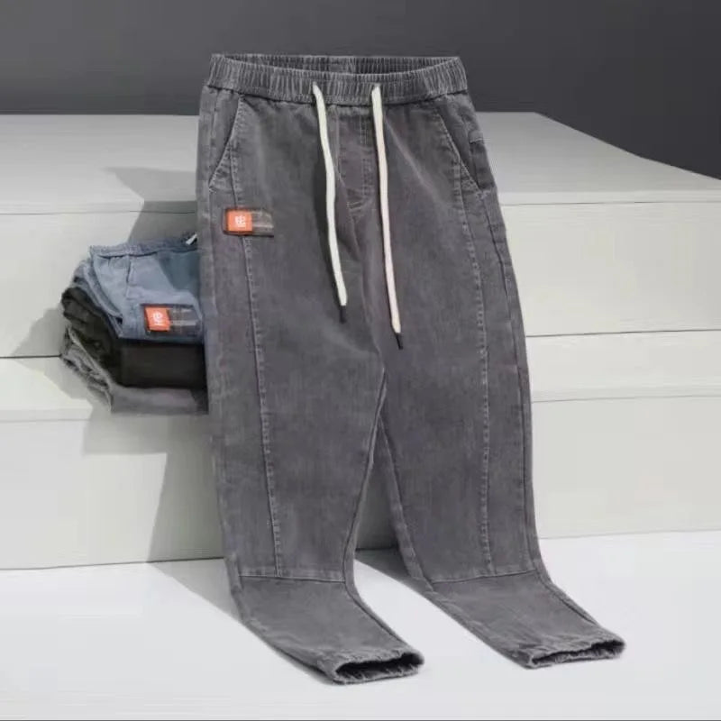 2023 Spring and Autumn New Classic Fashion Solid Color Haren Pants Men's Casual Slim Comfortable Elastic High Quality Jeans 5XL